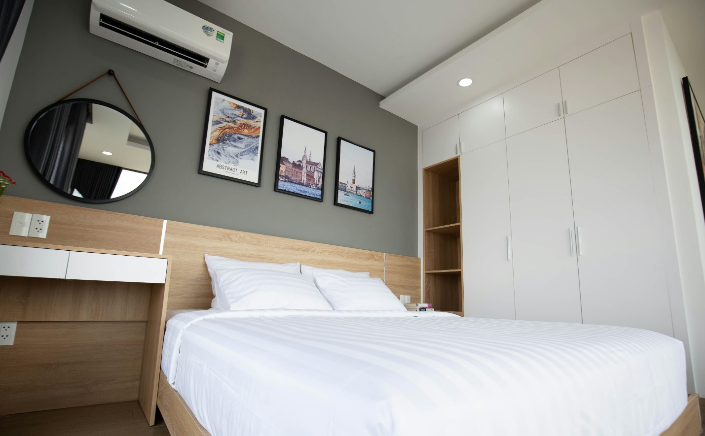 a bedroom with a large mirror